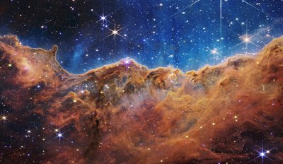 Cosmic Cliffs in the Carina Nebula by James Webb Space Telescope (NASA)