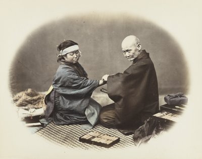 Japanese man and woman in traditional dress by Japanese Photographer