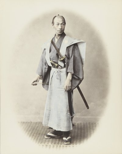 Japanese man with sword by Japanese Photographer