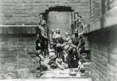 Japanese soldiers are involved in street fighting in Shanghai, China by Japanese Photographer