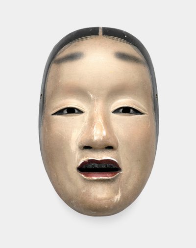 A wood mask with gofun ground, painted with sumi for the hair, eyes and teeth and red for the lips by Japanese School
