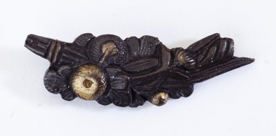 Menuki, or grip ornament, in the shape of a floral arrangement by Japanese School