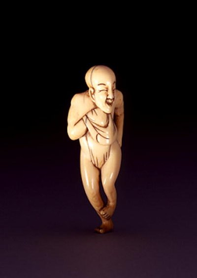 Netsuke of a horse-faced, dome-headed man, probably Osaka by Japanese School