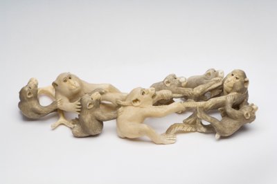 Okimono carved as eight Japanese Macaque monkeys engaged in neck wrestling by Japanese School