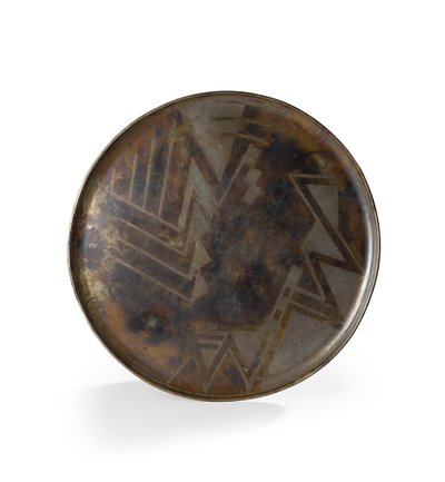 Charger in brown and silver patinated Dinanderie, c.1914 by Jean Dunand