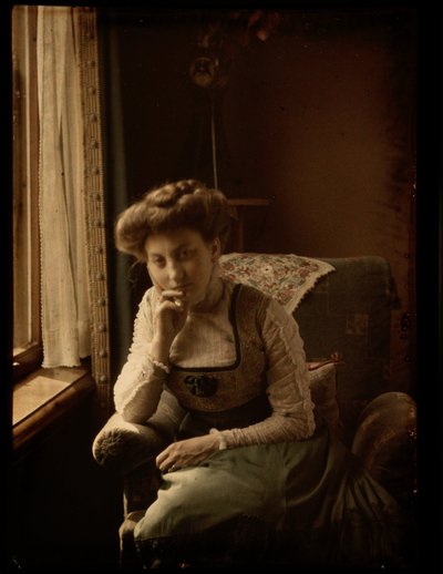 Woman sitting by the window by Johannes Hendrikus Antonius Maria Lutz
