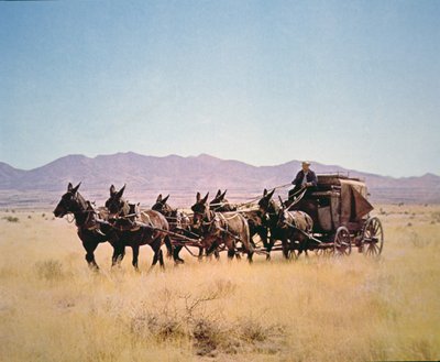 Western Stagecoach pulled by a six mule team by Walter Charles Mills