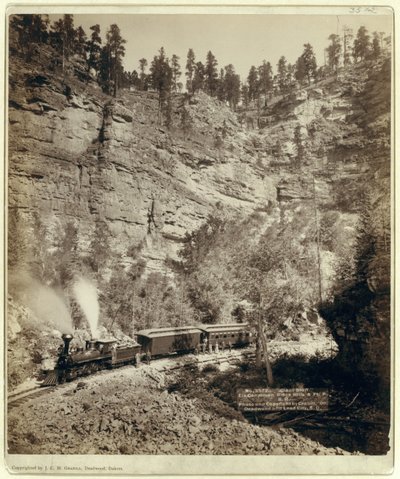 Train going through Elk Canyon by John C. H. Grabill