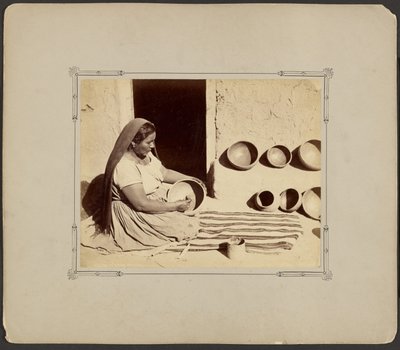 Woman Polishing Pottery by John K. Hillers