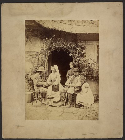 Group seated outside open doorway: two men in hats, woman in bonnet, two young girls - one standing by John Whistler