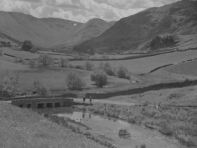 A View Looking Across a Bridge, Stream, Fields and Fells by Joseph Hardman