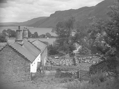 Farm buildings with sheep in farmyard and Ullswater in background by Joseph Hardman