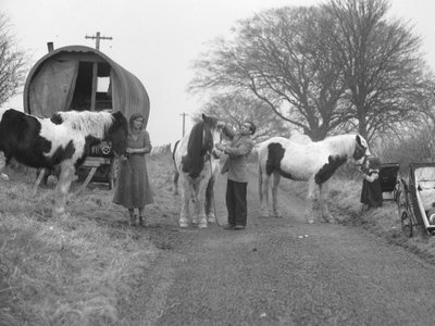Hooped van on verge of road with gypsies and horses by Joseph Hardman
