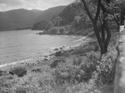 View of lakeshore and hills in background by Joseph Hardman
