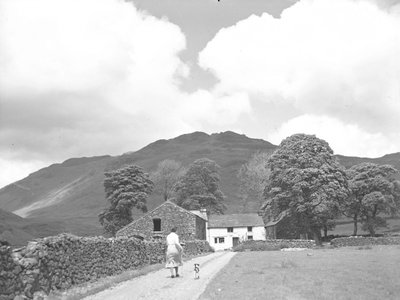 Woman and dog walking down track to Dalehead Farm by Joseph Hardman