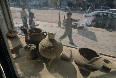 Afghanistan, Herat, antiquities for sale, window display, street scene, 2004 by Kenneth Garrett