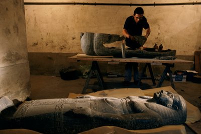 Fragments of the base of the sarcophagus of Senqed is reconstructed, New Kingdom by Kenneth Garrett