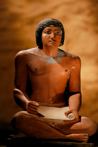 Painted limestone statue of a seated scribe, Old Kingdom, 2002 (photo) by Kenneth Garrett