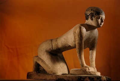 Painted limestone statue of a servant grinding grain, Old Kingdom, 2002 by Kenneth Garrett