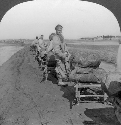 Conveying salt to the interior by wheelbarrow train, China, 1907 by Keystone View Company