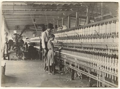 Man with Girl at Spinning Machine, South Carolina Cotton Mill by Lewis W. Hine