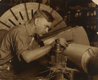 Man with Micrometer Measuring a Shaft to a Thousandth of an Inch by Lewis W. Hine