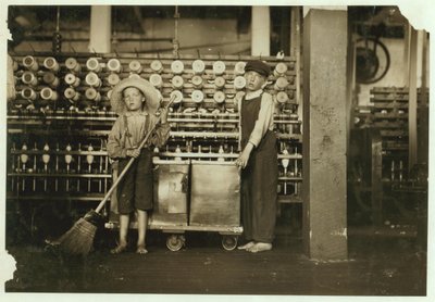 12 Year Old Doffer Ronald Webb and 7 Year Old Frank Robinson, Son of Cardroom Boss, Who Sweeps and Doffs at Roanoke Cotton Mills, Virginia, 1911 by Lewis Wickes Hine