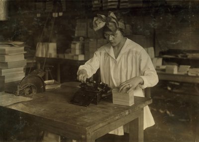 A Girl Stamping Labels at the Boston Index Card Co. at 113 Purchase Street in Boston, Massachusetts by Lewis Wickes Hine