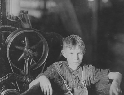 A young Polish spinner in the Quidwick Co. Mill by Lewis Wickes Hine