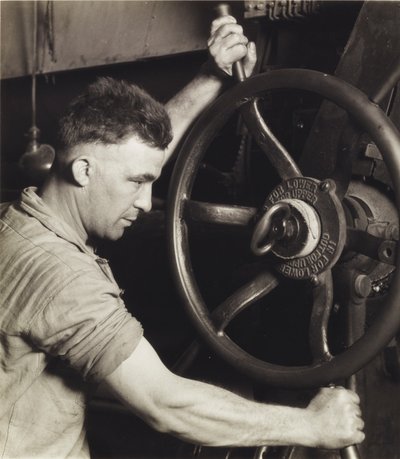 An Industrial Design: Pennsylvania Rubber Co. at the Control Wheel of a Great Calendar - Making Auto Tires by Lewis Wickes Hine
