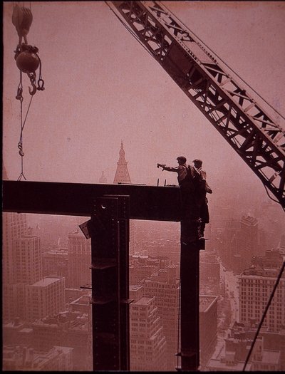 Empire State Building under construction, showing placing of steel girder by Lewis Wickes Hine