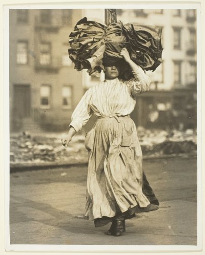 First Work in America, Italian Immigrant Carries Garments To The Tenement Home by Lewis Wickes Hine