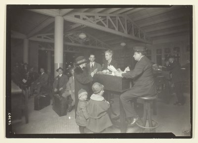 German Family, Interpreter and Recorder at Ellis Island by Lewis Wickes Hine