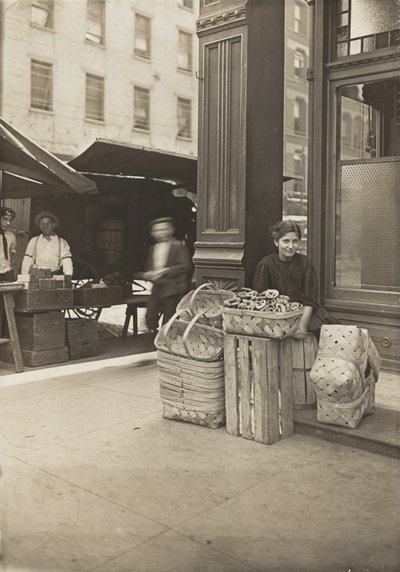 Lena Lochiavo, 11 years old, basket and pretzel seller, at Sixth Street market in front of saloon entrance, Cincinnati, Ohio, August 1908 by Lewis Wickes Hine