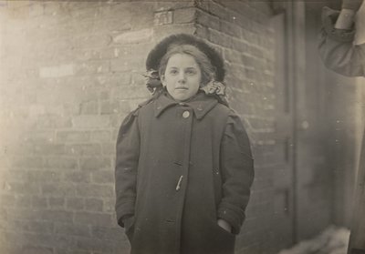 Mery Horn, a Hunchback Condition Aggravated by the Heavy Load of Papers She Carried. Hartford, Connecticut, March 1909 by Lewis Wickes Hine