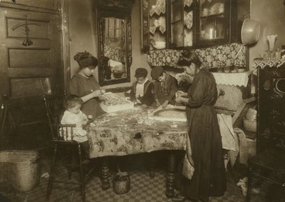 Mrs. Mette and Her Children Making Flowers in a Dirty New York Tenement, 1911 by Lewis Wickes Hine