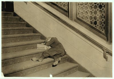 Newsboy Asleep with His Papers in Jersey City, New Jersey, 1912 by Lewis Wickes Hine