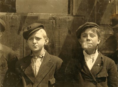Newsboys having a cigarette break, St. Louis, Missouri. 1910 by Lewis Wickes Hine