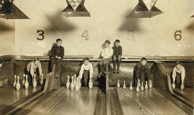 Young Boys Setting Up Bowling Pins at Arcade Bowling Alley Late at Night, Trenton, New Jersey, USA by Lewis Wickes Hine