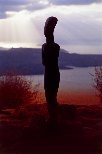 Cycladic Idol on the Background of the Coast at Sunset, Cyclades Islands, Greece, Cycladic Civilization by Unbekannt Unbekannt