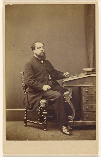 Unidentified bearded man seated at writing desk, in 3/4 profile by London Stereoscopic and Photographic Company