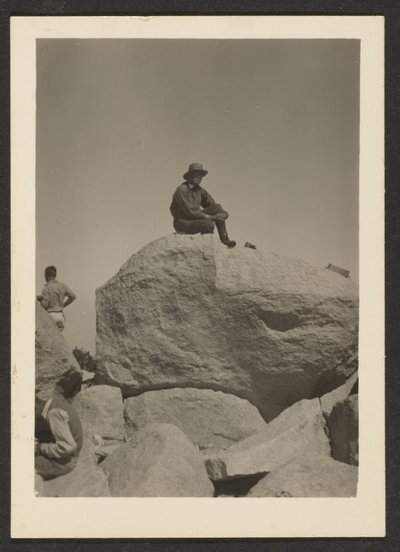 [Man Seated on Rocks] by Louis Fleckenstein