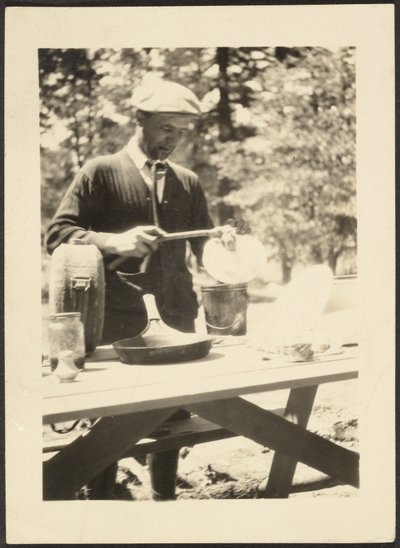 Man Standing at Picnic Table by Louis Fleckenstein