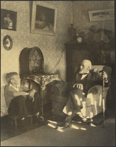Man and Boy Seated in a Study by Louis Fleckenstein