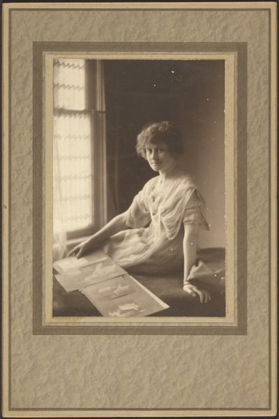 Portrait of a Woman Looking at Album by Louis Fleckenstein