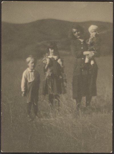 Woman and Three Children in Field by Louis Fleckenstein