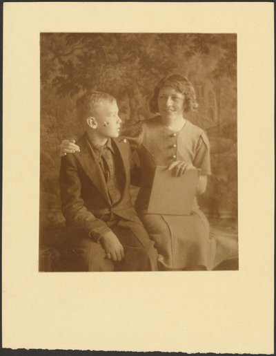 Woman and Young Man Seated Before Tapestry by Louis Fleckenstein