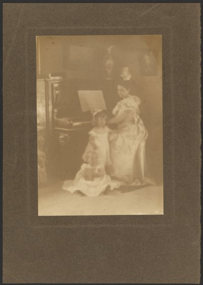 Woman at a Piano with Children by Louis Fleckenstein