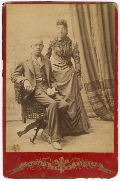 Photograph of African-American man and woman in formal clothes by Louis Janousek