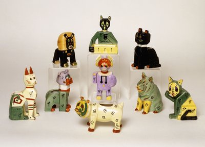 A Group of Porcelain Vases Shaped as Stylised Animals by Louis Wain
